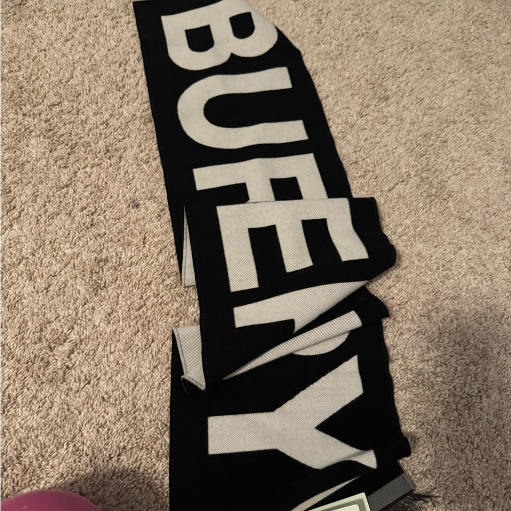 Authentic New never used Burberry Black and White scarf. Unisex